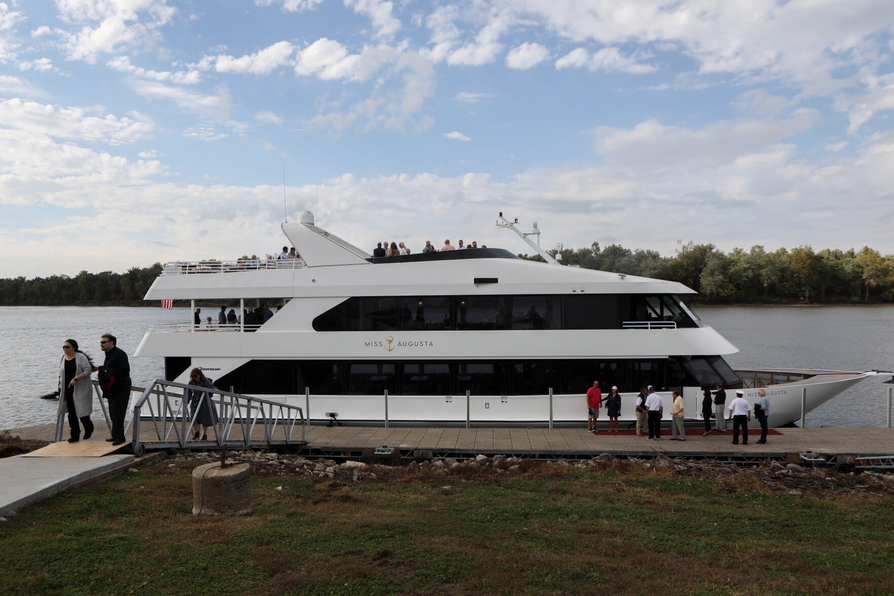 Passengers disembark from Miss Augusta